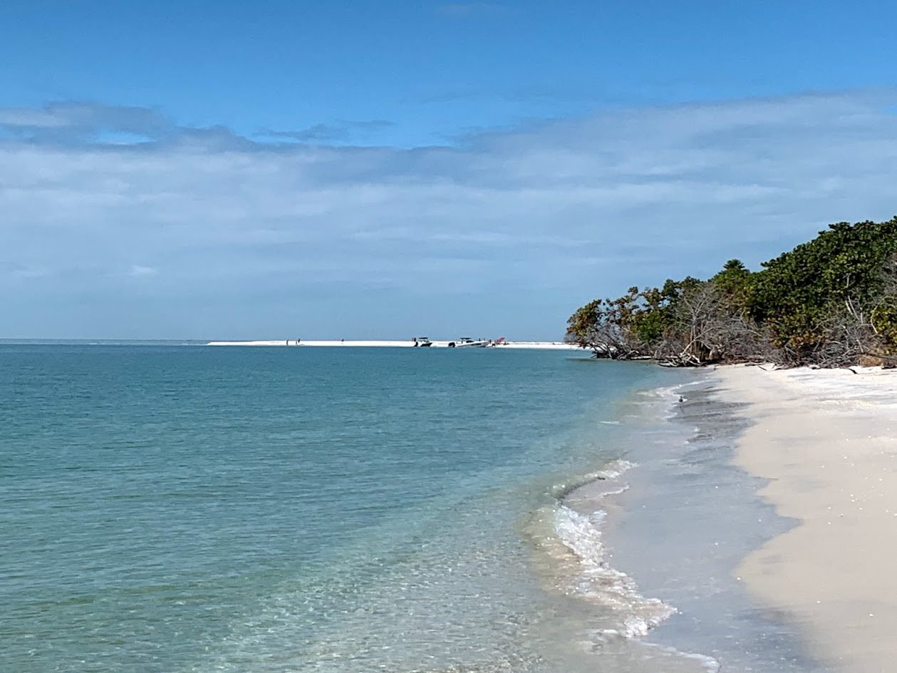 Pristine white sand shoreline and turquoise water at North Captiva Island, Florida, showing a secluded tropical beach with gentle Gulf waves.