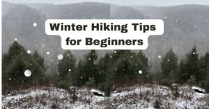 A panoramic snowy forest landscape with the text "Winter Hiking Tips for Beginners" centered over frost-covered evergreen trees.