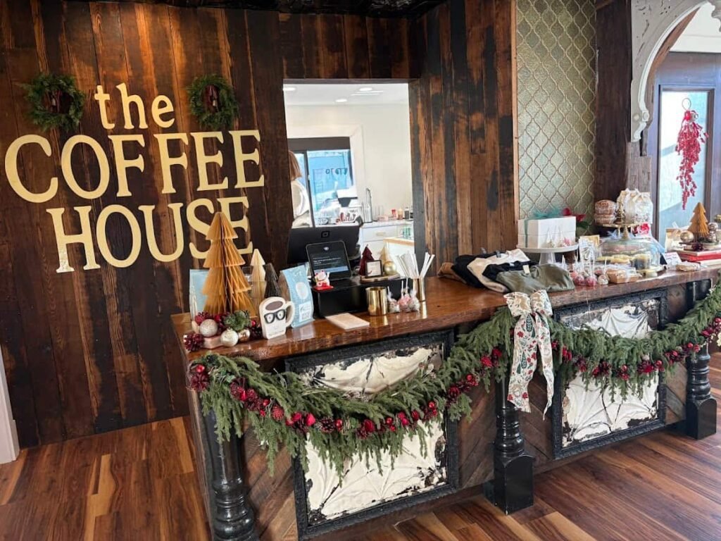 Inside The Coffee House of Plymouth showing the cozy counter area decorated with greenery and seasonal décor. A Relaxing coffee shop.
