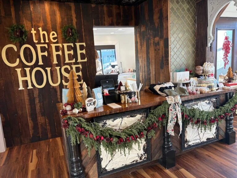 Inside The Coffee House of Plymouth showing the cozy counter area decorated with greenery and seasonal décor. A Relaxing coffee shop.