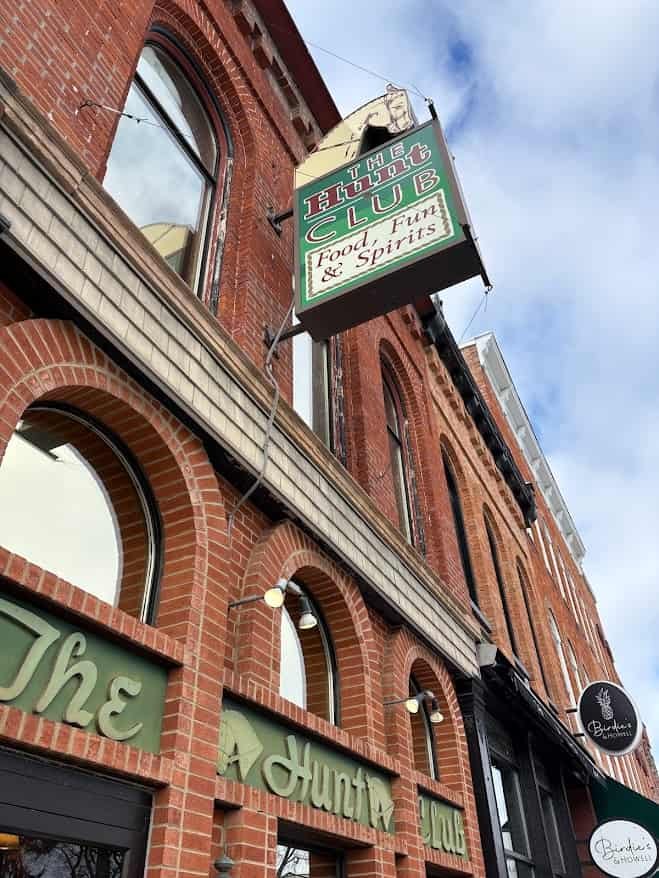 Outdoor sign for Hunt Club of Hillsdale restaurant in Hillsdale, Michigan.