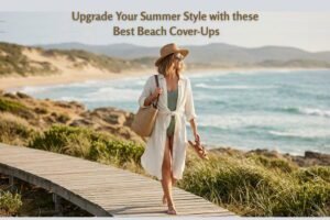 Woman walking on a beach boardwalk wearing a lightweight white swimsuit cover up and straw hat