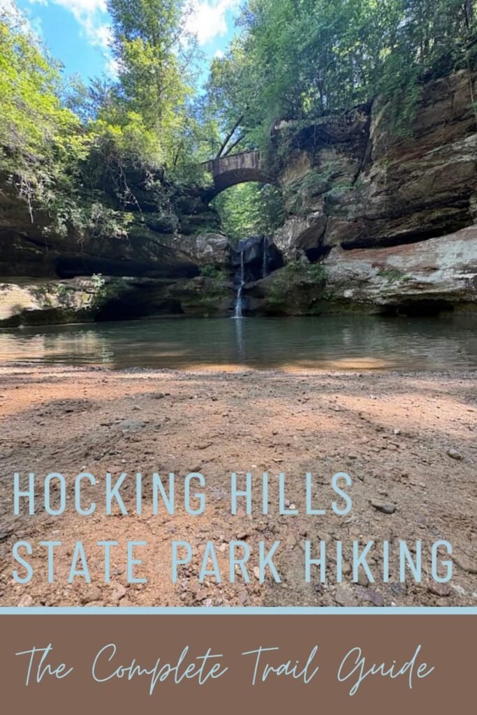 Vertical featured image graphic for an Ohio travel blog showing Upper Falls waterfall and the stone bridge at Hocking Hills State Park, with text overlay reading "Hocking Hills State Park Hiking: The Complete Trail Guide."