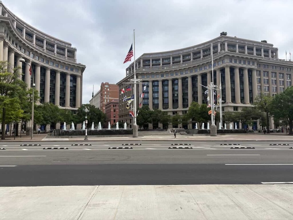 Architectural spaces like the United States Navy Memorial highlight the transition between historic outdoor plazas and the air-conditioned government buildings surrounding them.